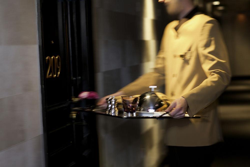 Sofitel Hamburg Alter Wall Exterior photo A bellboy with a bell